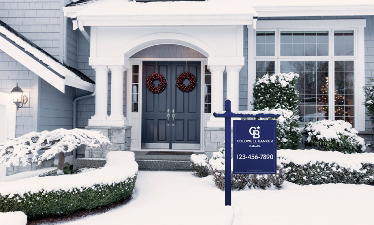 Front lawn of a home with a Coldwell Banker signage